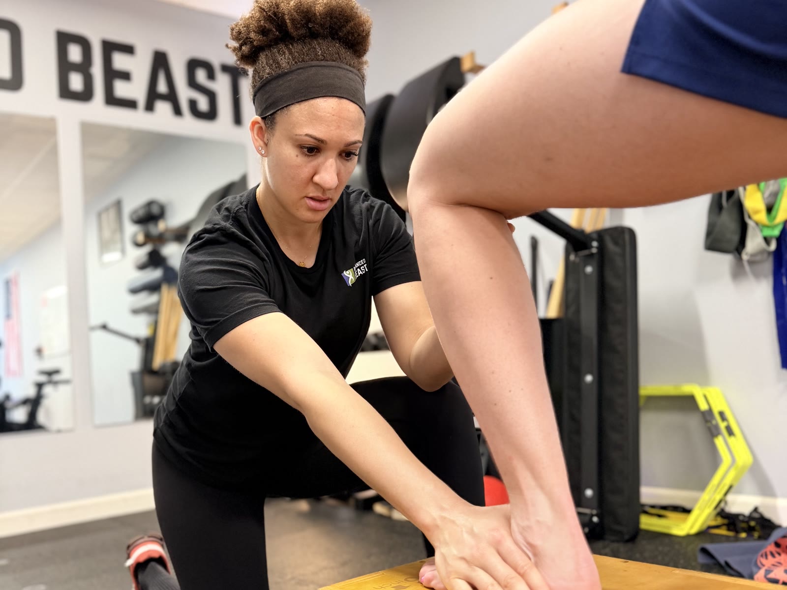 Dr. Mel Wilkerson working on ankle mobility with a patient